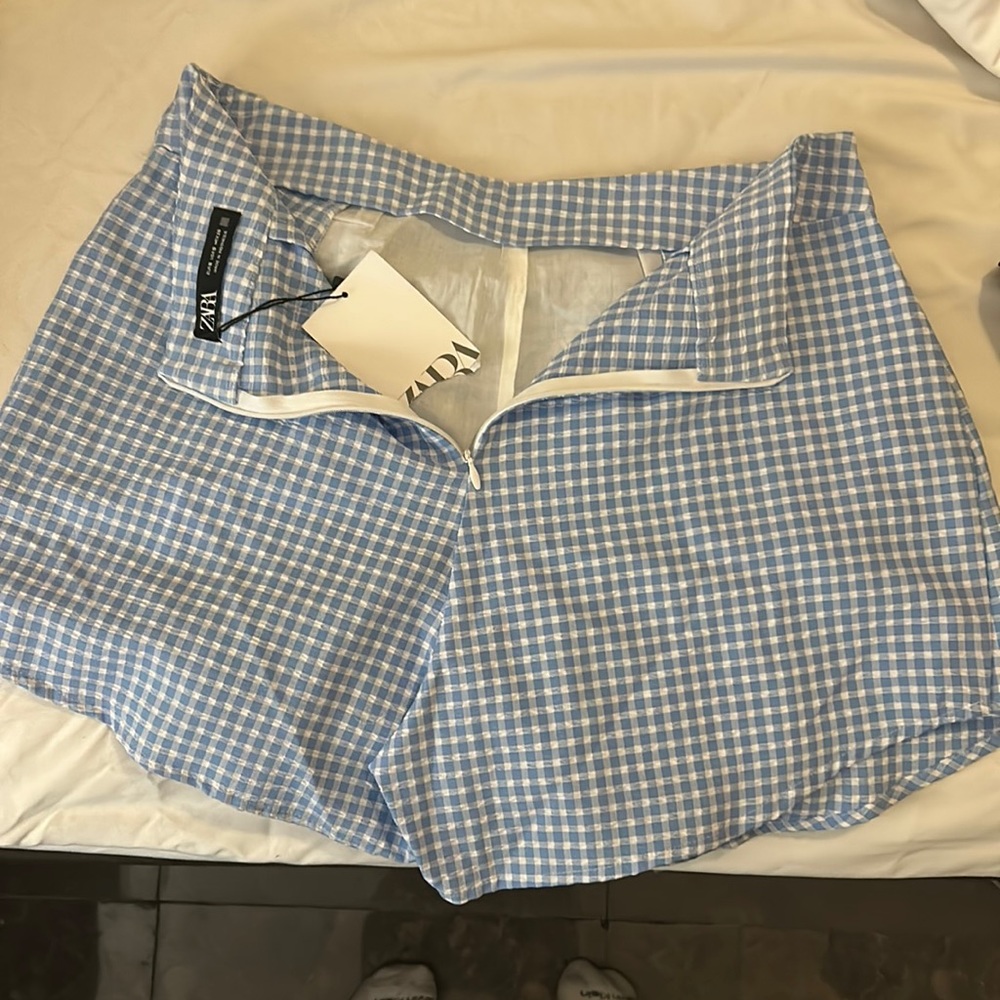 Small Zara skirt with tag. Plaid, light blue and white. With shorts. Skort.